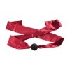 Silicone ball gag with satin straps.