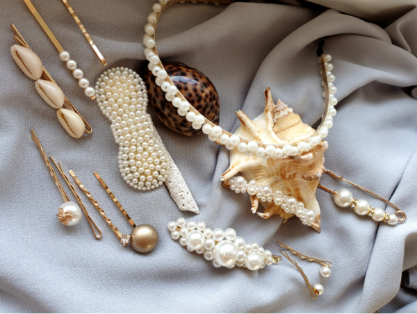 a set of clips with white pearls