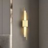 Designerska lampa na ścianę kinkiet metalowy złoty Sem Left