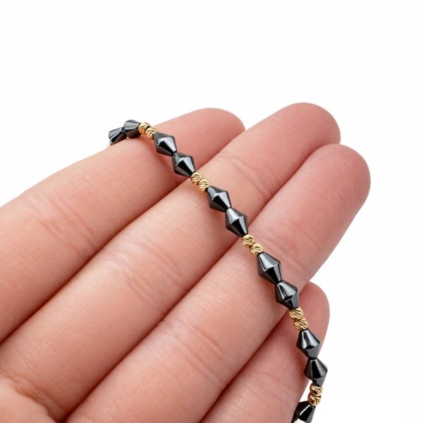 Bransoletka ze złotymi kulami i hematytem złoto 585 