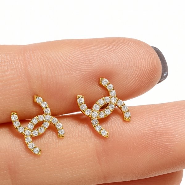 Kolczyki litery wysadzane kamieniami złoto 585