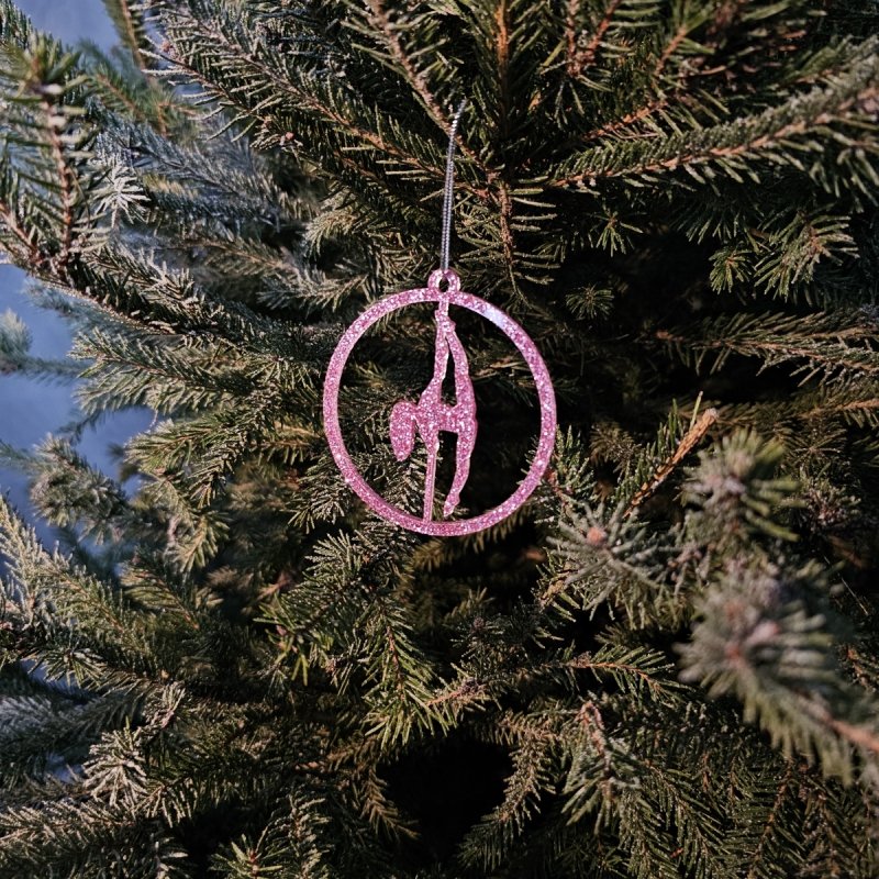 Close-up of the shining Pink Glitter Pole Dance Ornament on a tree branch