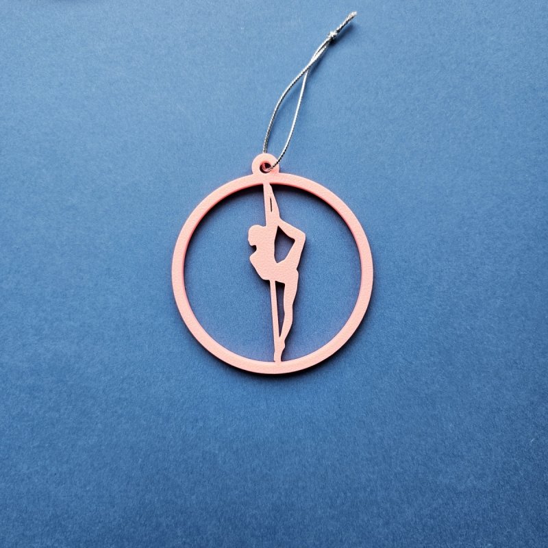 Pink Glow in the Dark Pole Dance Ornament (Pose B) on a blue background. Poledance Xmas Gift Idea