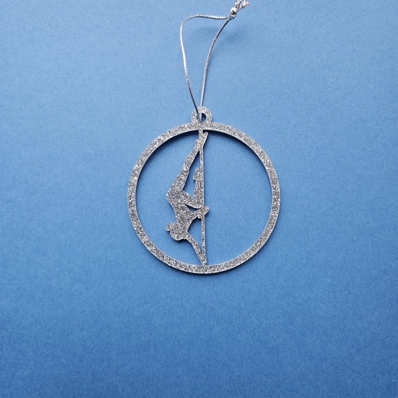 Silver Glitter Pole Dance Ornament Pose 1. Close-up of modern silver plexi material