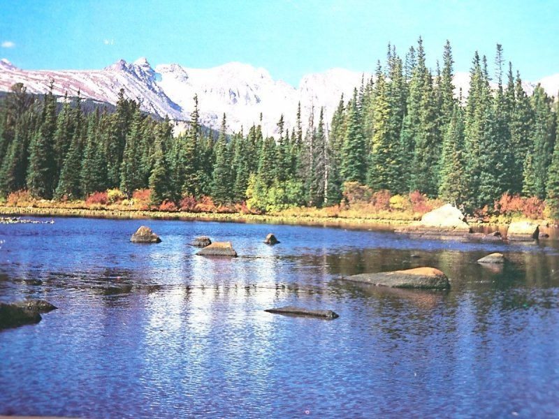INDIAN PEAKS WILDERNESS AREA TOWERS ABOVE RED ROCK