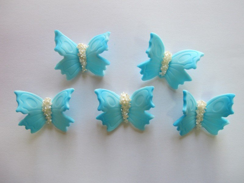Motylki cukrowe na tort duże niebieskie 3D 50szt