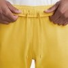 Nike komplet dresowy bawełniany męski spodnie bluza z kapturem żółty