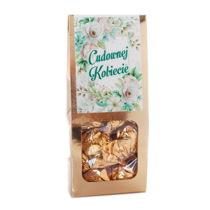 Pyszna pralinka w złotym opakowaniu z napisem Cudownej Kobiecie.  Wysokość 18 cm  Masa netto 108 g